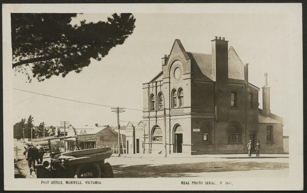 Black and white old photo of a double storey federation brick building
