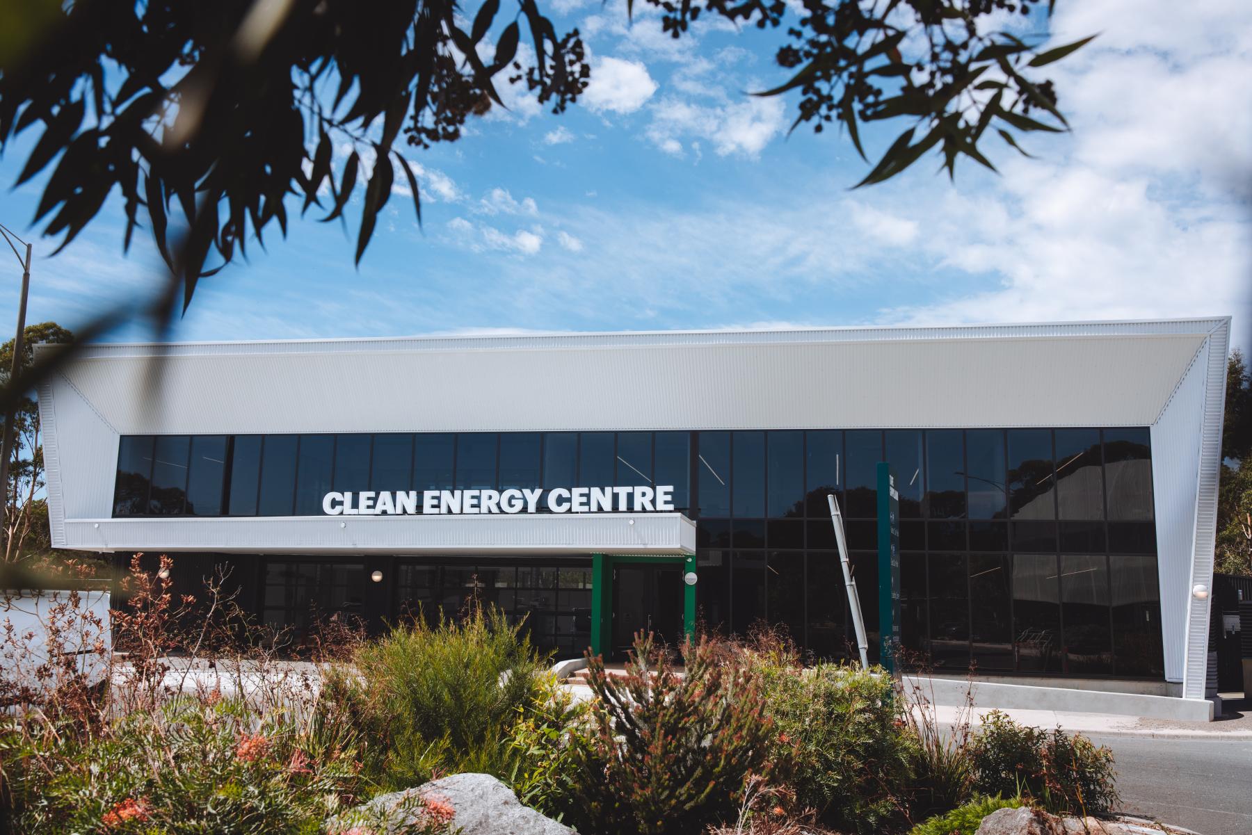 A glass-walled building with signage that says 'Clean Energy Centre'