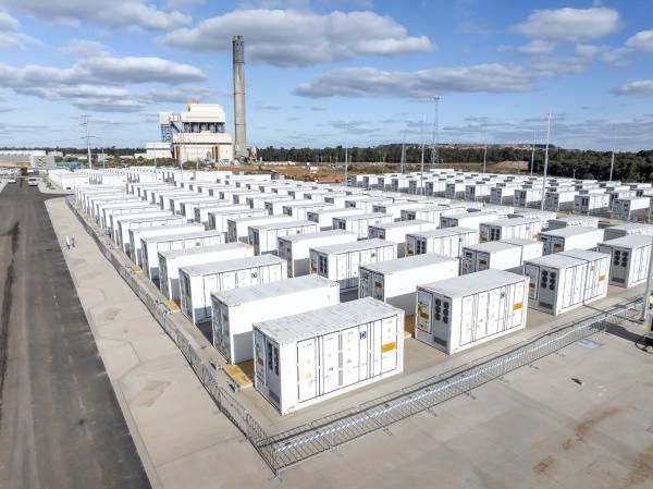 A grid of batteries, each one roughly the size of shipping containers
