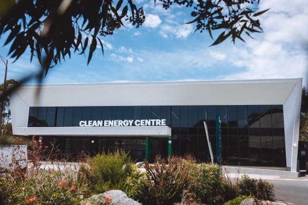 A glass-walled building with signage that says 'Clean Energy Centre'